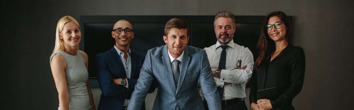 business team looking at the camera